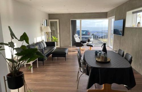 Hoyvik Apartment | Modern Apartment With City & Oceanside View