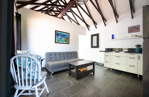 Roatan Cottage | Modern Beachfront Home - Steps from the Sea w/Patio, Shared Pool & Dock