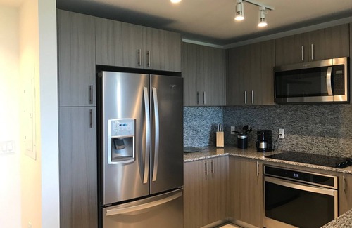 Doral Condo | Modern building, centrally-located condo,2 bedrooms/2 bathrooms, parking space.