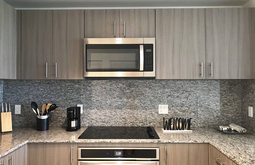 Doral Condo | Modern building, centrally-located condo,2 bedrooms/2 bathrooms, parking space.