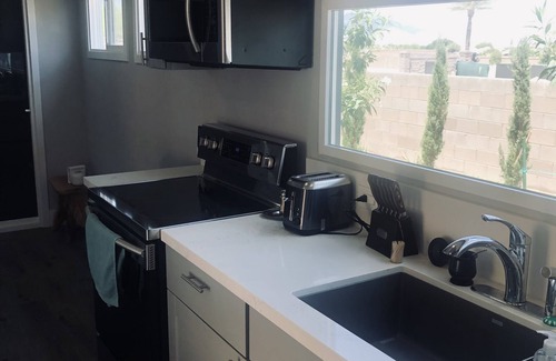 Las Vegas Cabin | Modern container home in Las Vegas with own soccer field and trees.