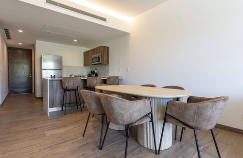 Playacar Condo | Modern, family-friendly condo with pool view, full kitchen & WiFi