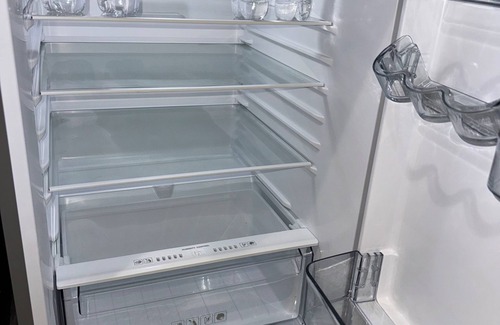 Liberty City House | Modern home with driveway parking and fenced yard.