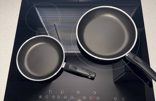 Liberty City House | Modern home with driveway parking and fenced yard.