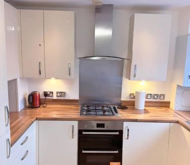 Little Hulton Apartment | Modern Home with Private Garden and Car Park in Manchester