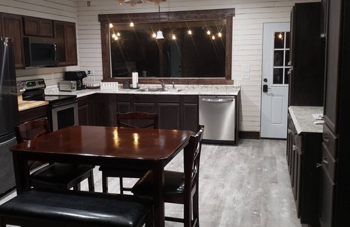 Tulsa Cabin | Modern Log Cabin with indoor and outdoor jacuzzi tubs