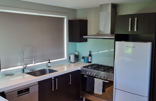 Wharewaka House | Modern, newly furnished house, with own putting green.
