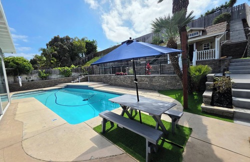 University City House | Modern Retreat with Pool, Game Room,Playhouse, Fenced Yard.