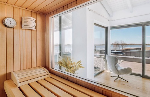 Waase Apartment | Modern vacation apartment on the Bodden with sun terrace, sauna and fireplace