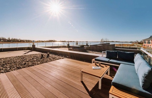 Waase Apartment | Modern vacation apartment on the Bodden with sun terrace, sauna and fireplace