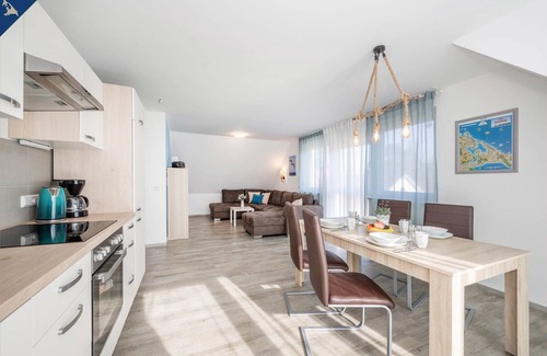Loddin Apartment | Modern vacation apartment in Loddin with garden, WLAN & playground - quiet and on the beach