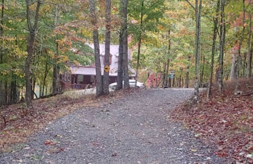 Unaka Cabin | Mountain views located on private lake all wood 3 story cabin.