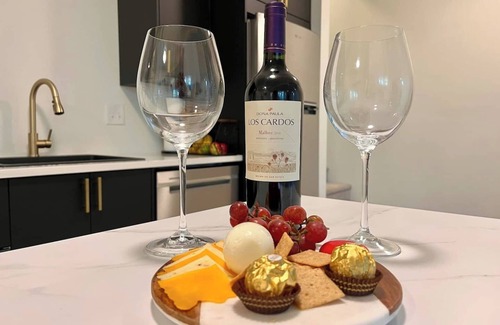 Loveland House | Nestled on the Marianna Butte Golf Course in Loveland, this modern garden-level basement retreat offers stunning mountain & lake views through large windows, flooding the space with light. Just a short drive to CSU campus & Estes Park