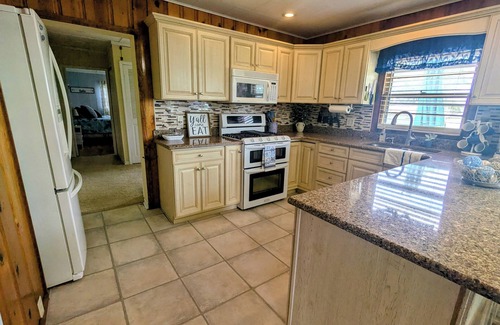 Bass Lake House | NEW! Cozy brick RANCH home with LAKE VIEWS along with Peace AND Serenity!