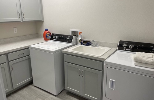 Indian Waters House | New Stilt Home on quiet canal with wrap around porch.