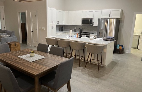 Indian Waters House | New Stilt Home on quiet canal with wrap around porch.