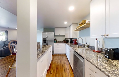 Fort Collins House | Newly built walkout basement with water views, patio, & Ping-Pong table