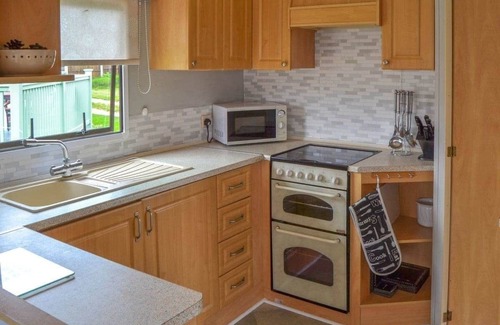 Bacton House | Norfolk Poppy Caravan - Sleeps 4 with Free WiFi and SKY TV.