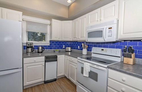 South Beach House | Ocean front duplex with master balcony overlooking the beach; newer six passenger golf cart