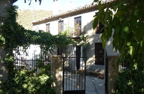 Montefrio House | Old mill, restored in a contemporary rustic style