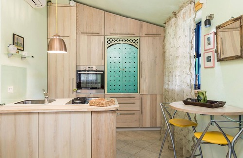 Sveti Ivan Dobrinjski House | On a well-kept and fenced property is this small vacation home with a heated outdoor pool.