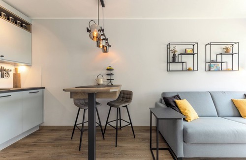 Wenningstedt-Braderup Apartment | One room and many possibilities: the high-quality couch invites you to c