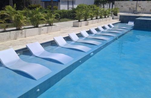 Villas Del Mar Apartment | Playa Juan Dolio, RD-Acceso Privado A La Playa Justo Al Frente En 1ra Línea, Áreas Sociales, BBQ, Piscina, Gazebos-Parqueo-Wifi-Netflix-Al Lado De Minimarket, Restaurantes, Bares, Tiendas, Clubes de Playa, Campos De Golf, Bancos Comerciales y más