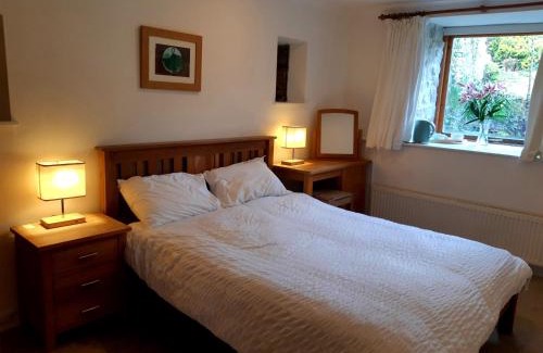 Tewitfield House | Plough Cottage is a 18th Century barn conversion offering a tranquil rural retreat 9 miles from the Lake District National Park