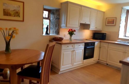 Tewitfield House | Plough Cottage is a 18th Century barn conversion offering a tranquil rural retreat 9 miles from the Lake District National Park