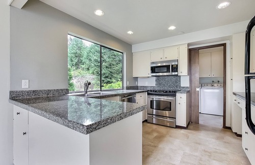 Gig Harbor House | PNW MCM 155ft Private Waterfront Gem on Raft Island w/Hot Tub by RedAwning