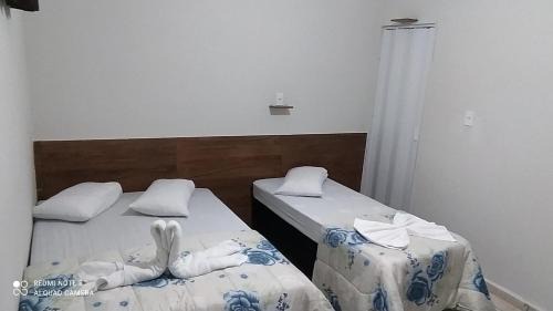 Aparecida House | Pousada Quarto com tv,ar,frigobar,wifi e garagem