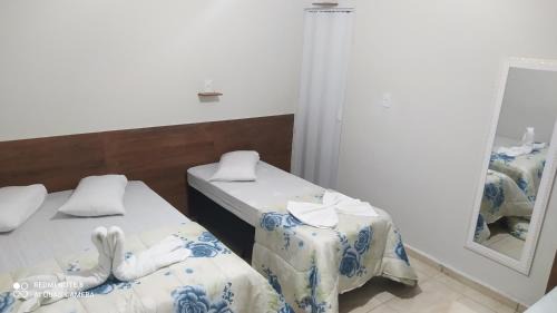 Aparecida House | Pousada Quarto com tv,ar,frigobar,wifi e garagem