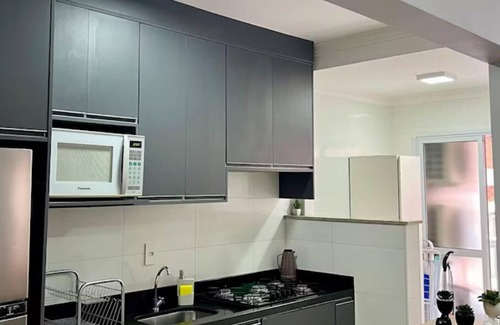 Praia Grande Apartment | Praia Grande Paradise! Feet in the sand! Facing the Sea.