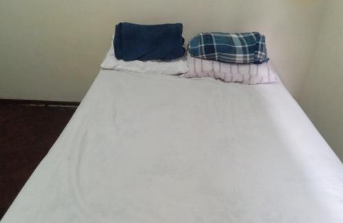 Nazareth House | Quarto com vista pra Piscina