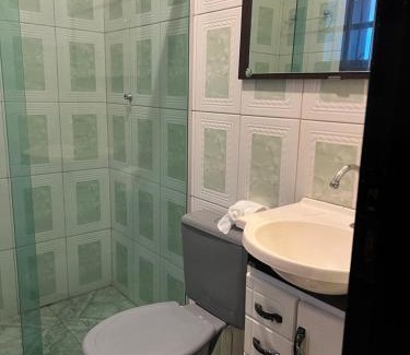 Jardim Primavera House | Quarto suite em Caraguatatuba