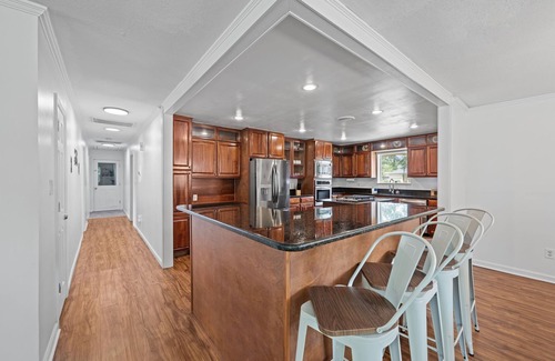 River Bend House | Quiet Riverfront 3BR/2BA house with Spa, Dock, and Golf Carts