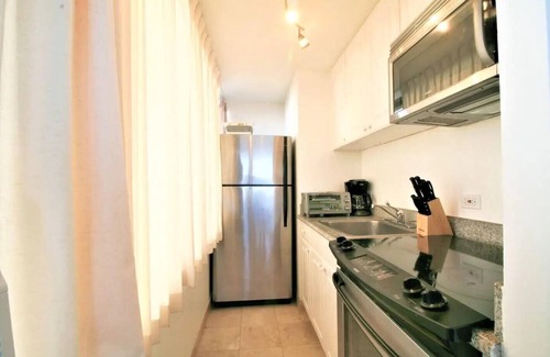 McCully - Moiliili Condo | Rare Unique Corner Unit 180 degree Ocean Canal View-34th Floor with Full Kitchen