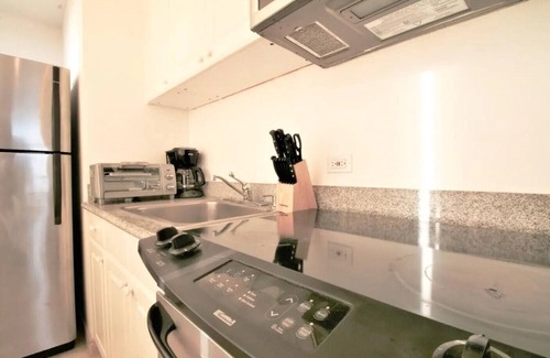 McCully - Moiliili Condo | Rare Unique Corner Unit 180 degree Ocean Canal View-34th Floor with Full Kitchen