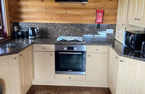 Allendale Cabin | Real Log cabin with hot tub and fire pit. Pet friendly