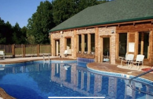 Spencer Cabin | Recline in the room in front of the fireplace with your PET