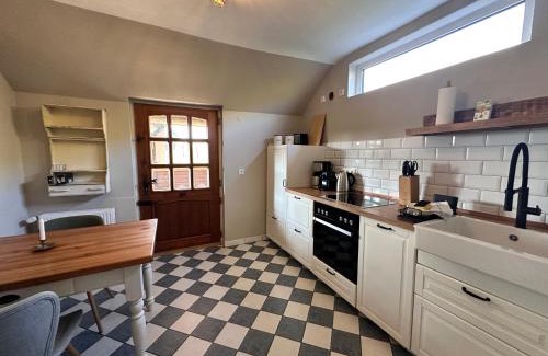 Kronsnest House | Reetdachkate am Deich