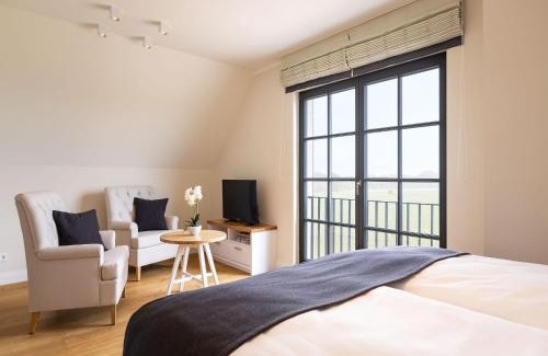 Kreptitz House | Reetland am Meer - Premium Reetdachvilla mit 2 Schlafzimmern, Sauna und Kamin E25