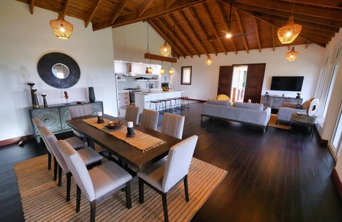 Gibson Bight House | Relax at this hillside retreat that overlooks the lush forest and the Caribbean.