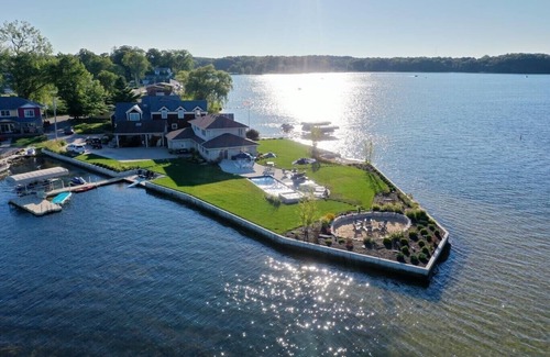 La Porte House | Retreat on the point of Pine Lake with your own pool/ hot tub.