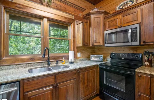 Cleveland Cabin | Riverfront 3BR Cabin minutes to Table Rock. Fire pit, hot tub, and game room.