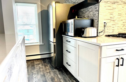 Rockford House | Rockford 2BD w/EV Charger, Patio & Fast WiFi, Upscale Furnished Rentals in Rockford, IL | Ideal Sho