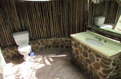 Thorny Bush Game Reserve House | Romantic canvas pad on river, share shower with monkeys and listen to the lions