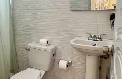 Higuey Hotel | Romantic Hispanic 304 private room with refrigerator and dining area.