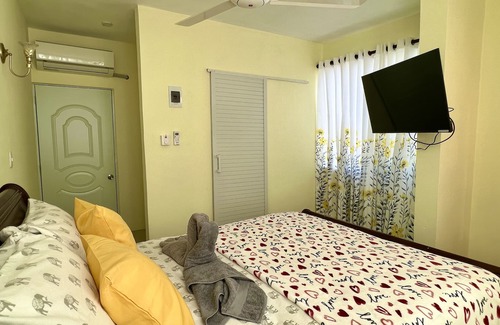 Higuey Hotel | Romantic Hispanic 304 private room with refrigerator and dining area.