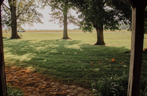 Rumsey Cabin | Rustic 1800s' Log Cabin with Modern Amenities on an Old Farm close to Owensboro